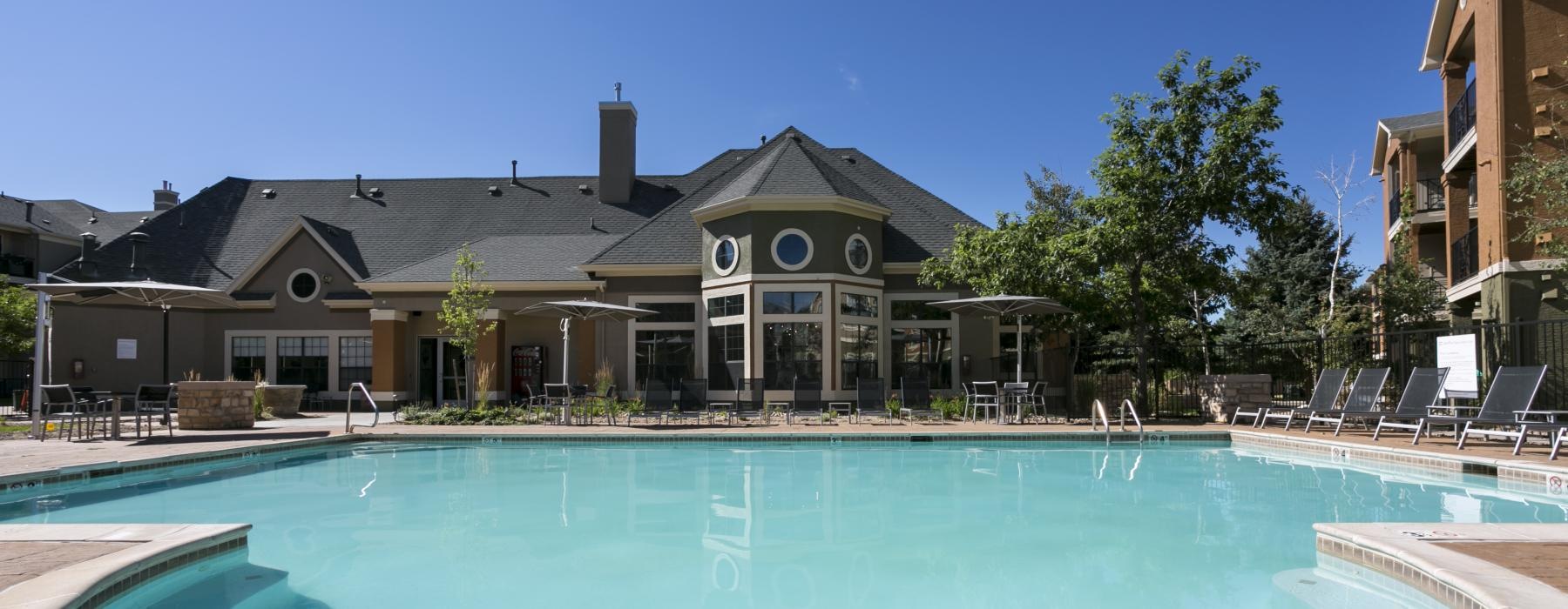 a swimming pool in front of a house