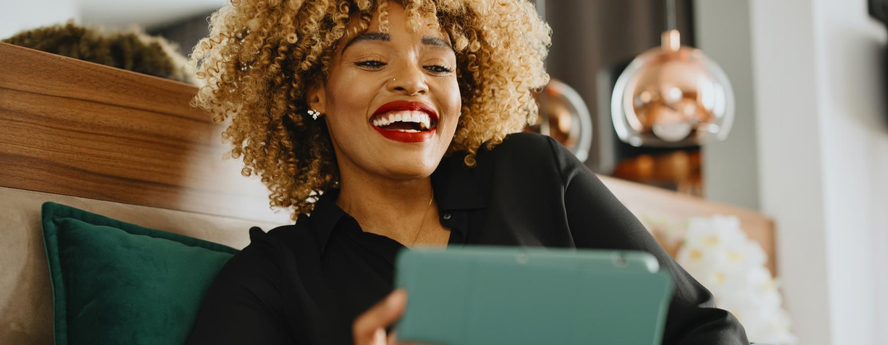 a woman holding a laptop