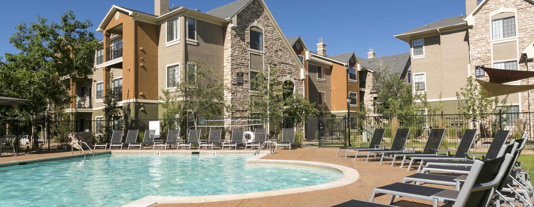 a pool with chairs around it