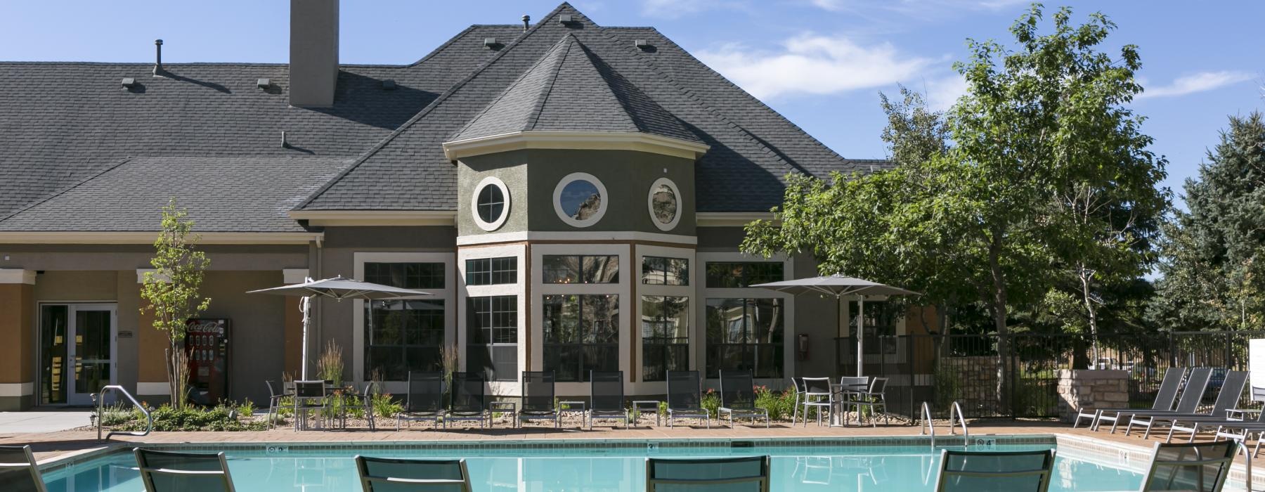a pool with chairs around it