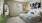 a bedroom with a bed and a mirror